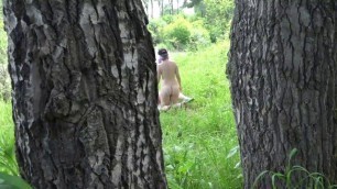 Voyeur outdoors peeps at two naked lesbians. Nudists with big asses sunbathe and enjoy nature and masturbation.
